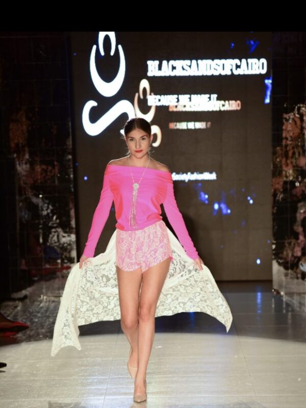 Girl in pink dress on runway